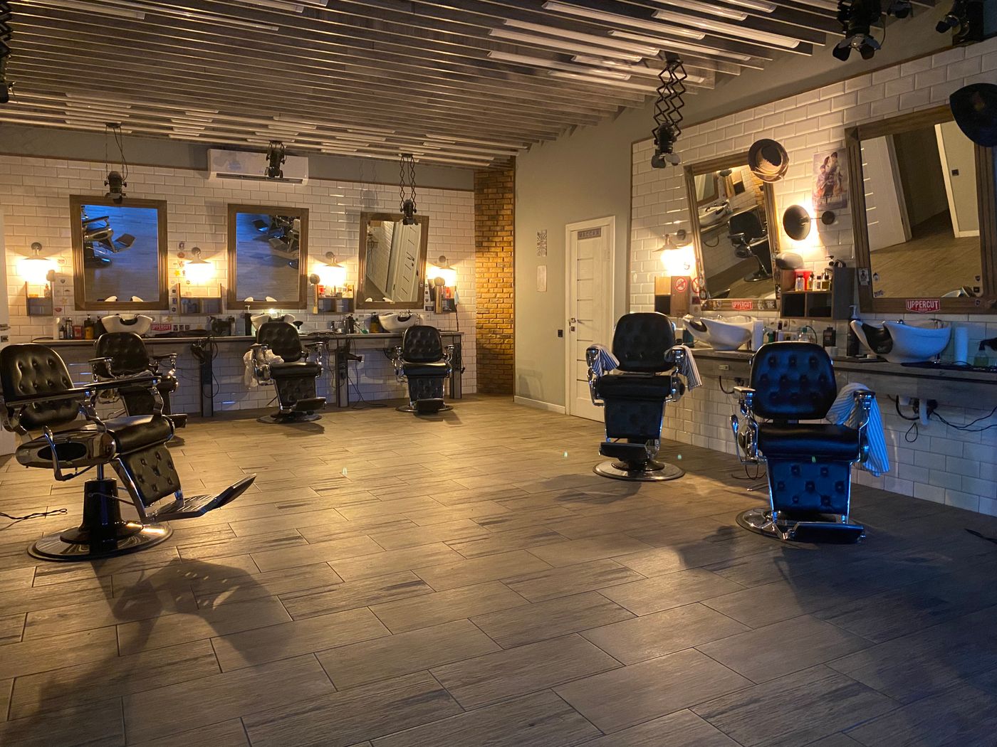The warm interior of the shop, chairs empty before opening